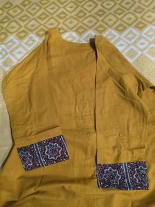Stylish Mustard Kurta Set with Embellished Necklin