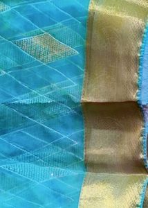 Elegant Teal Saree with white Diamond type Pattern