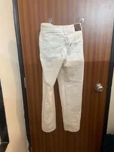 Cream Distressed Denim Jeans