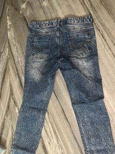 Distressed Blue Denim Jeans
