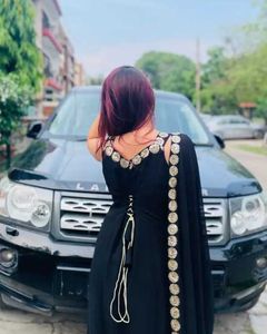 Elegant Black Saree with Gold Embellishments