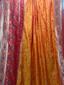 Vibrant Silk Saree with Intricate Red Borde