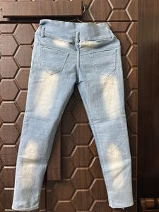 Distressed Light Wash Denim Jeans