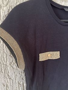 Chic Black Top with Gold Accents