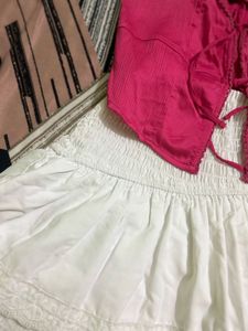 Chic Pink Lace-Up Crop Top with white skirt