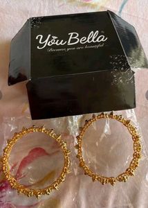 Elegant Gold Bangle with Stone Embellishments