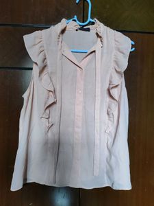 Chic Pink Ruffled Sleeveless Blouse