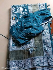 Elegant Teal Saree with Intricate Designs