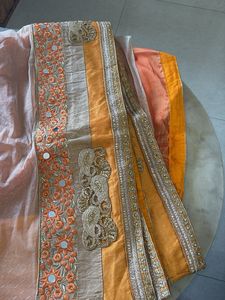 Elegant Orange Saree with Intricate Border