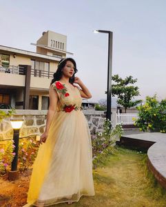 Elegant Princess gold Gown with Red Roses