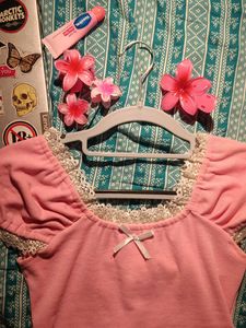 Pink lacey top with a bow