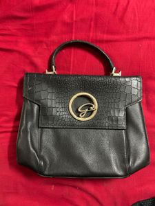 Chic Black Handbag with Gold G Logo