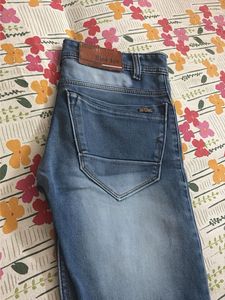 Distressed Blue Denim Jeans
