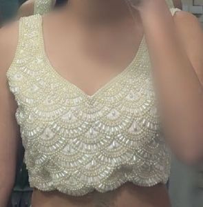 Wine color saree with pearl embedded blouse