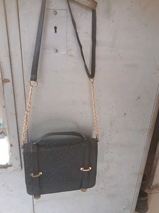 Chic Black Satchel Bag with Gold Accents
