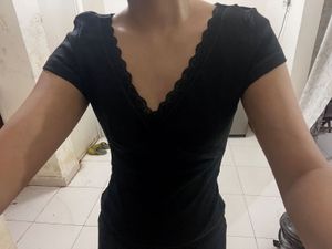 Chic Black Lace Trimmed V-Neck Top