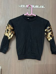 Black sequin sleeve top