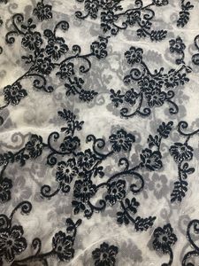 White net saree with black velvet design