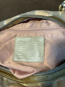 Chic Coach Shoulder Bag with Gold Accents