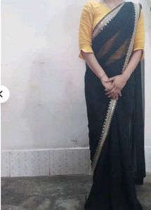 Elegant Black Saree with Golden Embellishments