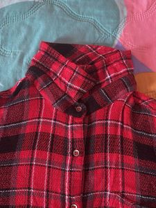 Red and black plaid flannel shirt.