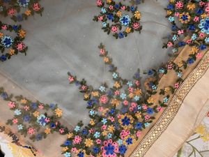 Powder blue floral net saree