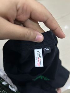 Black "Share-ing is caring" T-Shirt