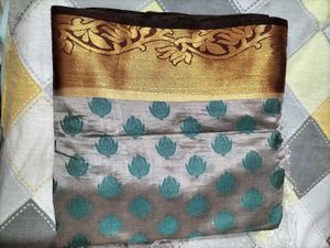 Elegant Silk Saree with Teal Motifs