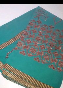 Elegant Teal Saree with Intricate Print