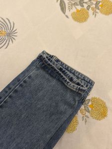 Distressed Blue Denim Jeans