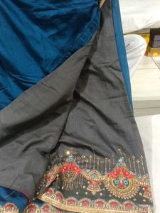 Elegant Teal Saree with Embellished Border
