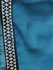 Elegant Teal Saree with Embellished Border
