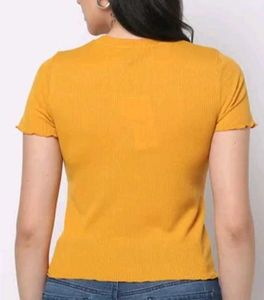 Yellow crop top and bootcut pants co-ord set