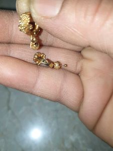 Gold Dangle Earrings with Intricate Design