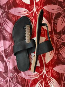 Stylish Black Thong Sandals with Gold Accents