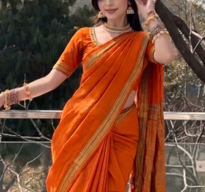 Vibrant Orange Saree with Gold Border