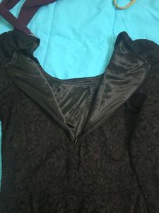 Elegant Black Dress with Gold Buttons