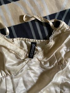 Lace-trimmed sweetheart neckline