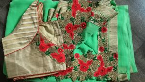 green colour saree with heavy cutwork border in pallu and golden work border all ever with stitched blouse