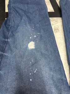 Distressed Blue Denim Jeans
