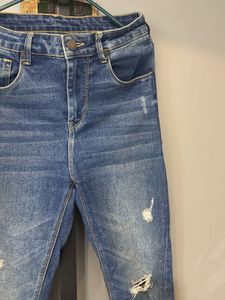 Distressed Blue Denim Jeans
