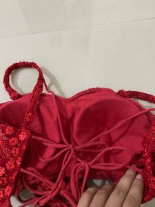 red backless blouse