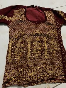Exquisite Maroon & Gold Embellished Lehenga Choli