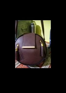 Stylish Round Maroon Handbag