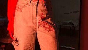 It's a blue wide leg jeans with hand paint