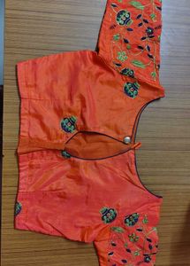 Cream saree with orange blouse