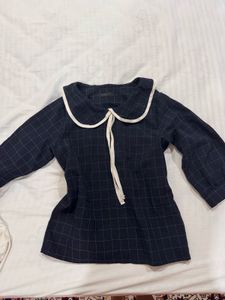 Peter Pan collar windowpane grid blouse.