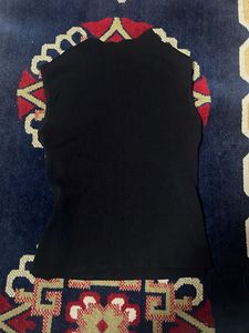 Sleek Black Sleeveless Turtleneck Top