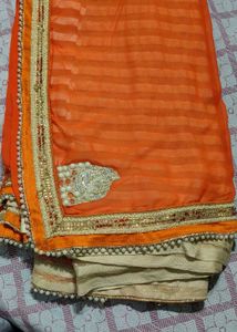 Elegant Orange Saree with Embellished Border