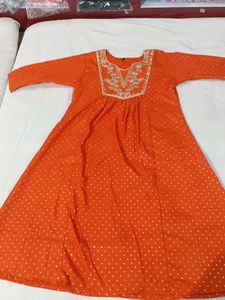 Vibrant Orange Kurti with White Polka Dots